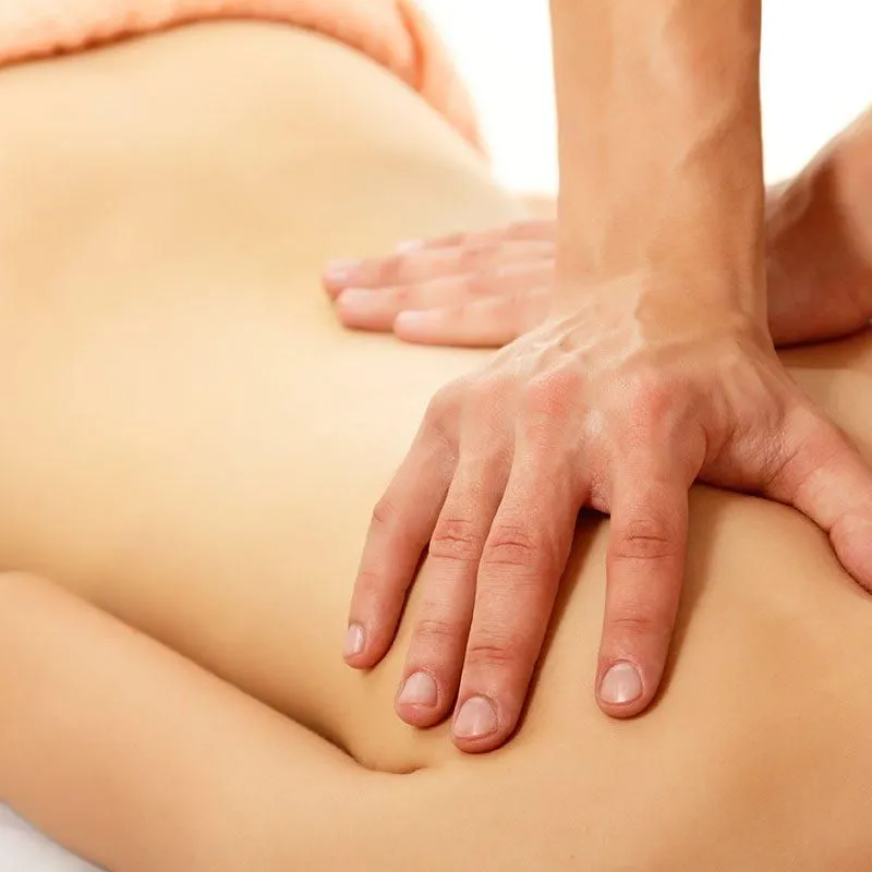Hands applying a cross-hand myofascial release technique