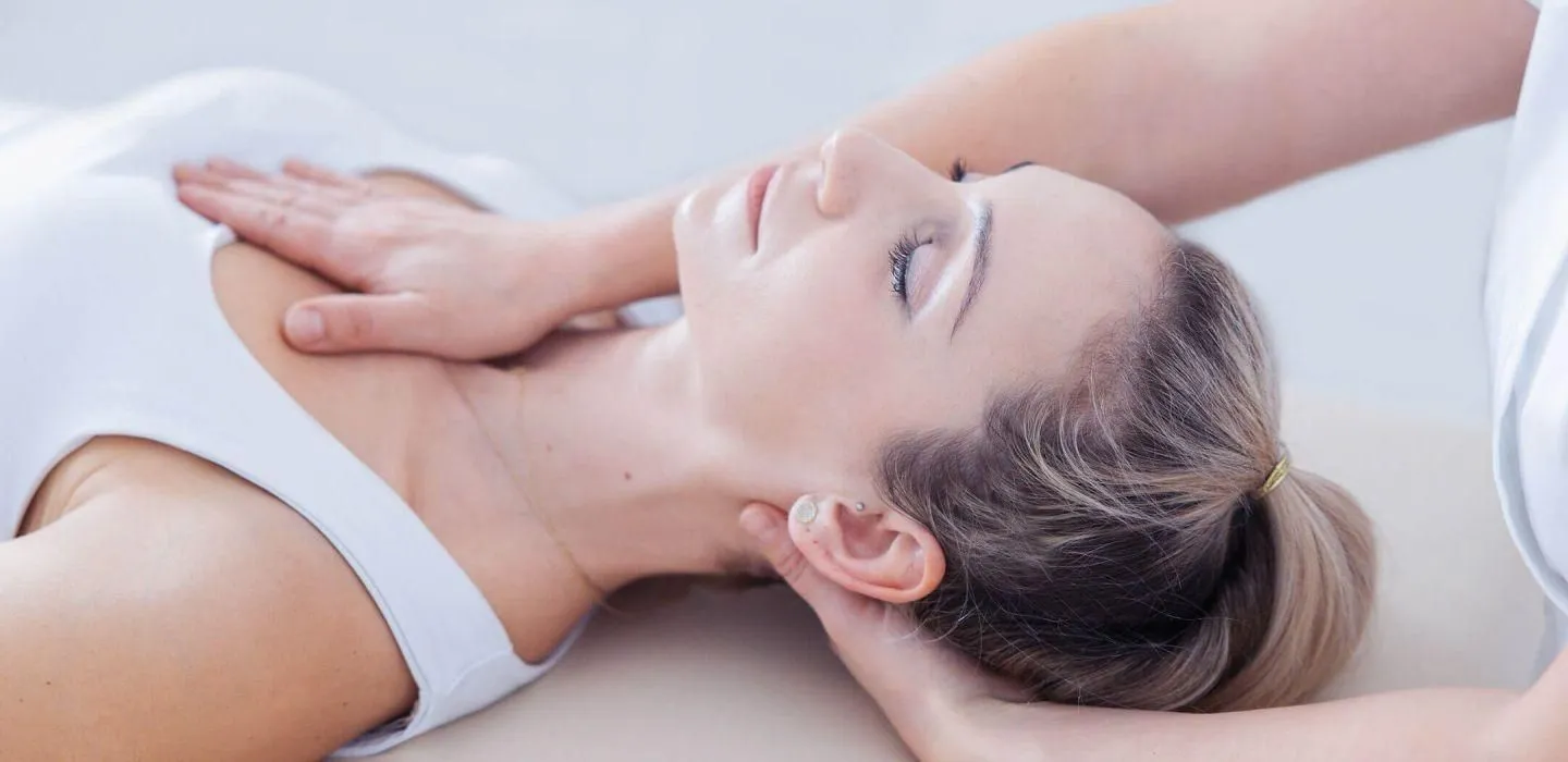 Gentle hands-on myofascial release treatment around the head and neck